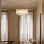 101 textured transparent Murano glass tube chandelier hanging in a livingroom