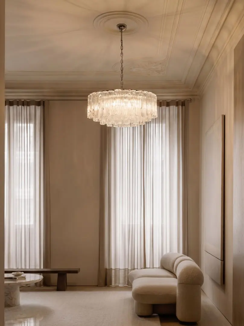 101 textured transparent Murano glass tube chandelier hanging in a livingroom