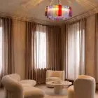 101 multi tube Murano chandelier hanging in livingroom.