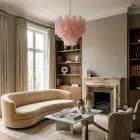 36 matte pink Murano glass tube chandelier hanging in a livingroom